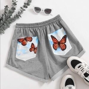 Grey shorts with butterfly patch pockets